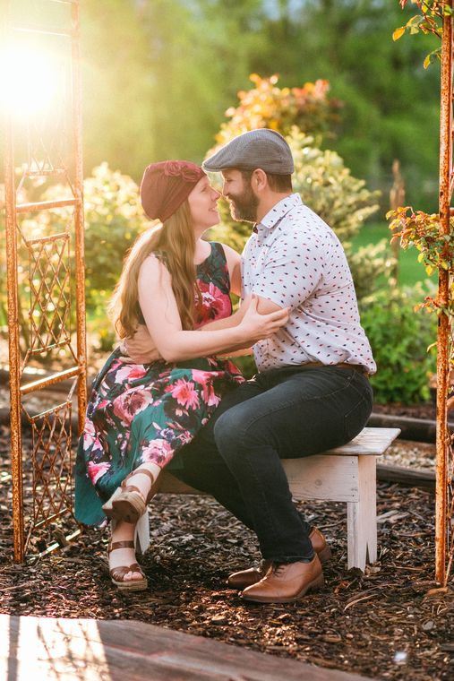 Couple at the garden arbor in golden evening light at On Collin's Pond