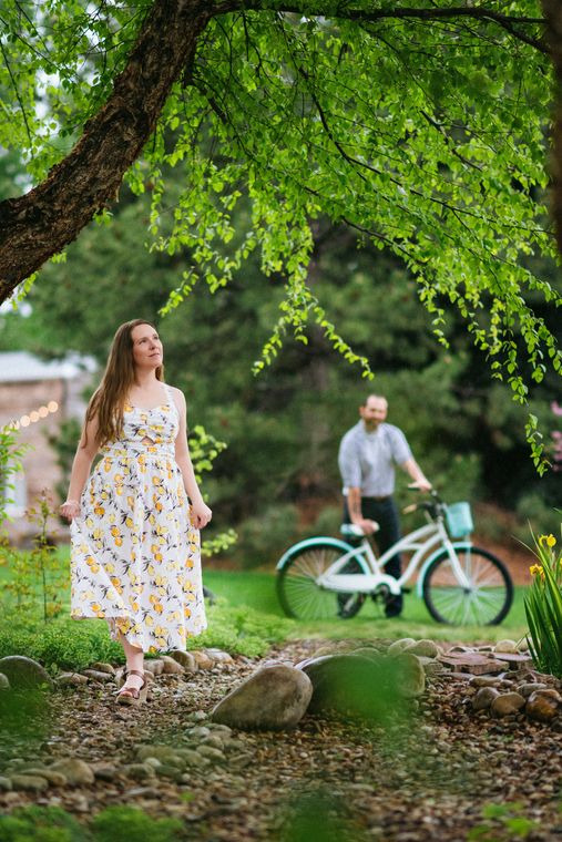 A guest walking the shaded garden path at On Collin's Pond in Middleton, Idaho