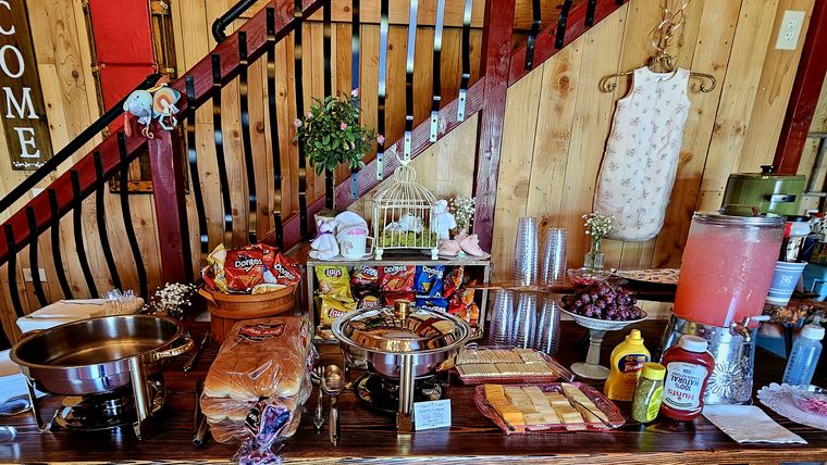 Buffet and dessert spread laid out for a celebration at On Collin's Pond