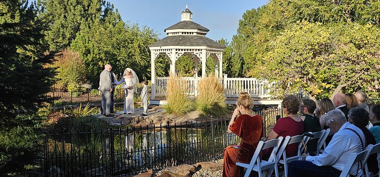 Wedding ceremony at the gazebo across the koi pond at On Collin's Pond in Middleton, Idaho
