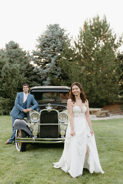 Bride and groom with the classic car on the lawn at On Collin's Pond