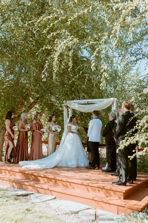 Autumn wedding ceremony on the garden platform at On Collin's Pond