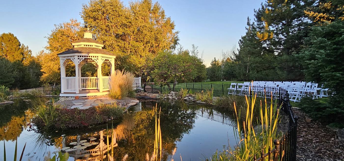 Autumn evening view across the koi pond to the gazebo at On Collin's Pond wedding venue in Middleton, Idaho
