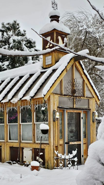 The old-world greenhouse under fresh snow at On Collin's Pond