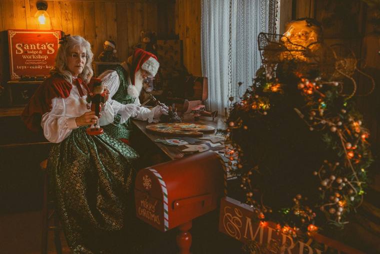 Mrs. Claus and Santa at the workbench in Santa's Lodge & Workshop, photographed by Jerry Moyer Photography