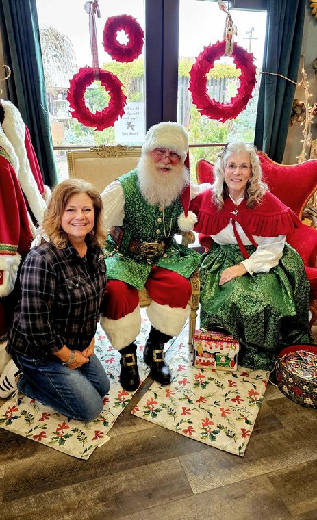 Santa Phil and Mrs. Claus with a visitor at an off-site Christmas event