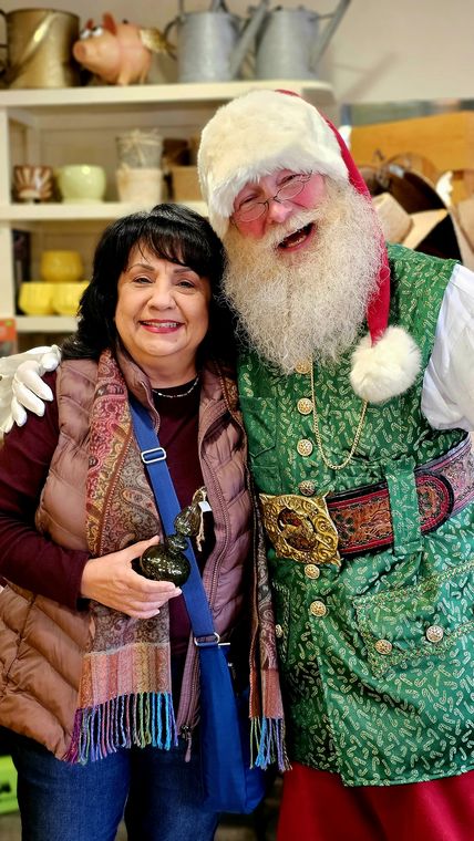 Santa Phil greeting a guest at an off-site Christmas event