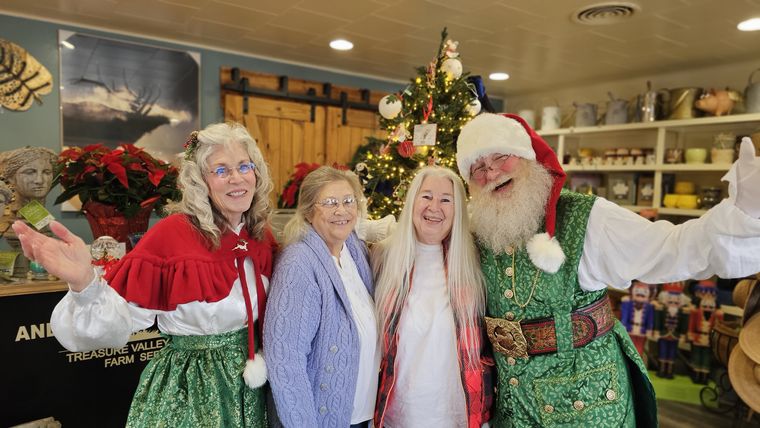 Santa Phil and Mrs. Claus with guests at an off-site Christmas event