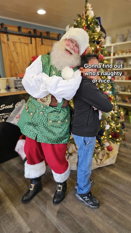 Santa Phil with a young visitor at an off-site Christmas event