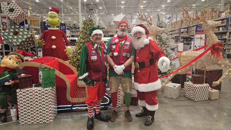Santa Phil with elves and staff at an off-site Christmas event