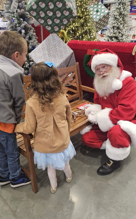 Santa Phil with children at an off-site Christmas event