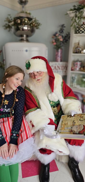Santa Phil with a young visitor in Chelsea's Sweet Shoppe at On Collin's Pond