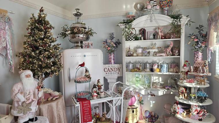 Chelsea's Sweet Shoppe decorated for Christmas with the St. Nick's Candy Shop sign and lit tree