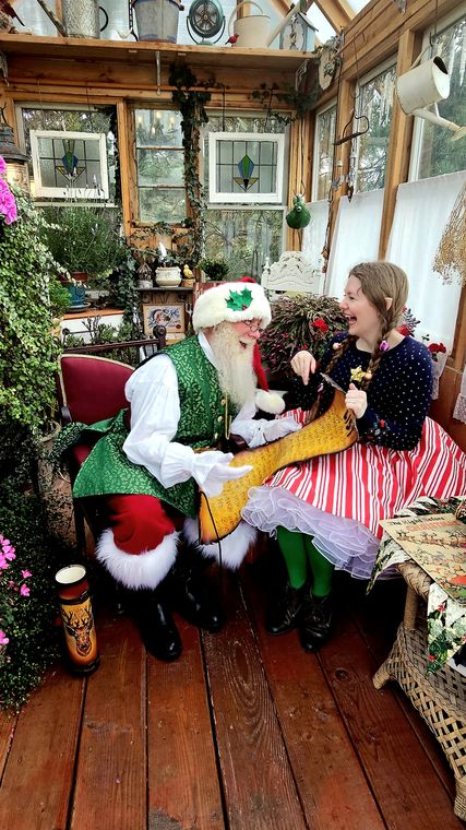 An elf with a visitor in the greenhouse at On Collin's Pond