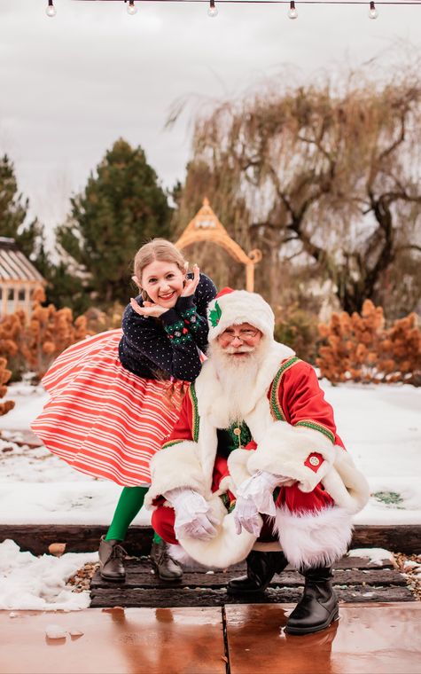 Santa Phil and an elf on the snowy grounds at On Collin's Pond